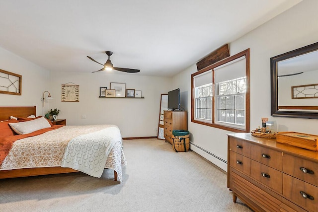 bedroom with baseboard heating, ceiling fan, and light colored carpet