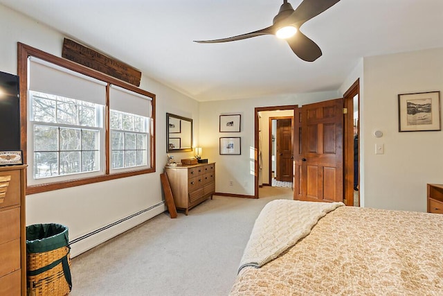 bedroom with ceiling fan, light carpet, and a baseboard radiator