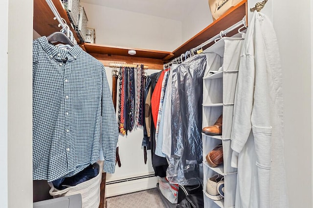 walk in closet featuring a baseboard heating unit