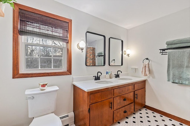 bathroom with toilet, a baseboard radiator, and vanity