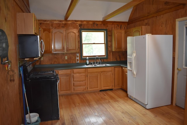 kitchen with white refrigerator with ice dispenser, sink, lofted ceiling with beams, gas range oven, and light hardwood / wood-style flooring