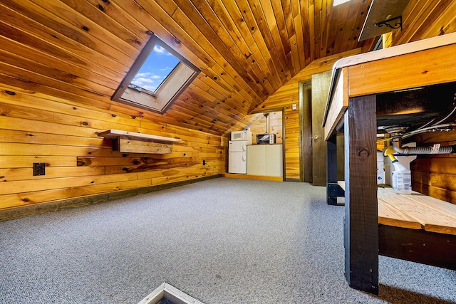 additional living space with wood ceiling, wooden walls, and vaulted ceiling with skylight