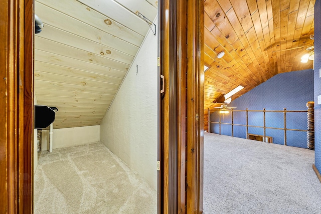 additional living space featuring lofted ceiling, light carpet, ceiling fan, and wood ceiling