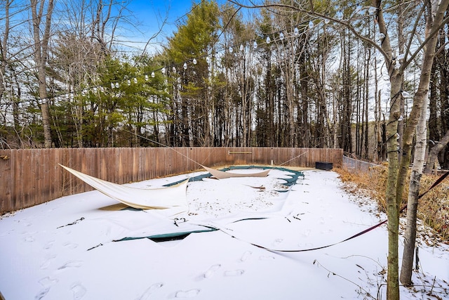 view of yard layered in snow