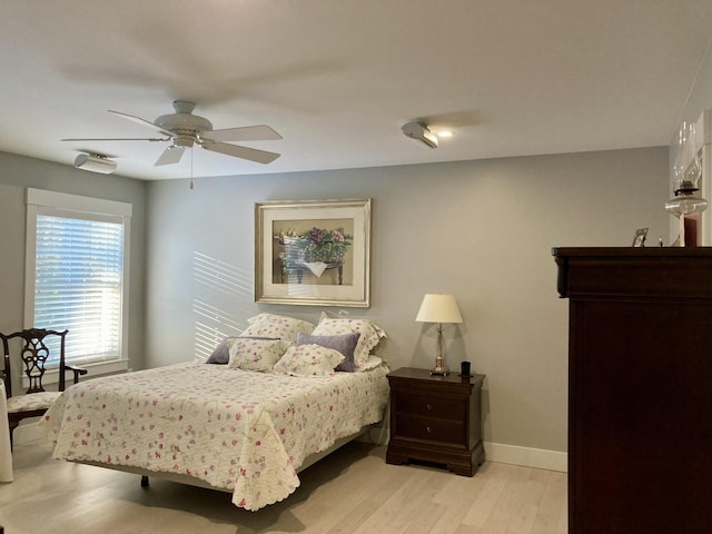 bedroom featuring ceiling fan and light hardwood / wood-style flooring