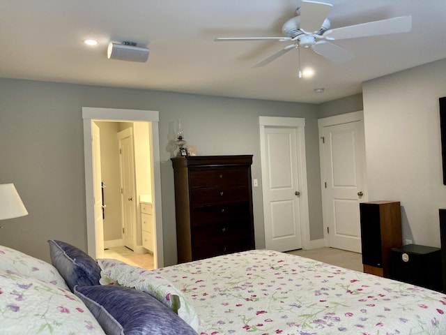 bedroom featuring ceiling fan and connected bathroom