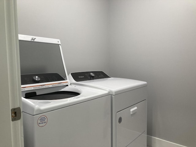 laundry room with separate washer and dryer