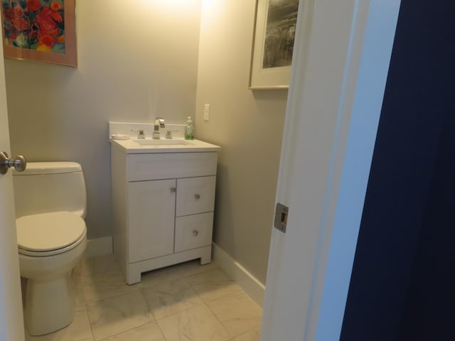 bathroom featuring toilet and vanity