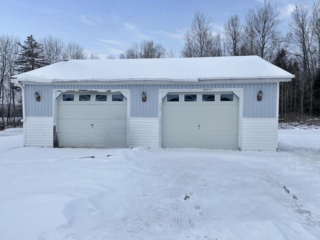 view of snow covered garage