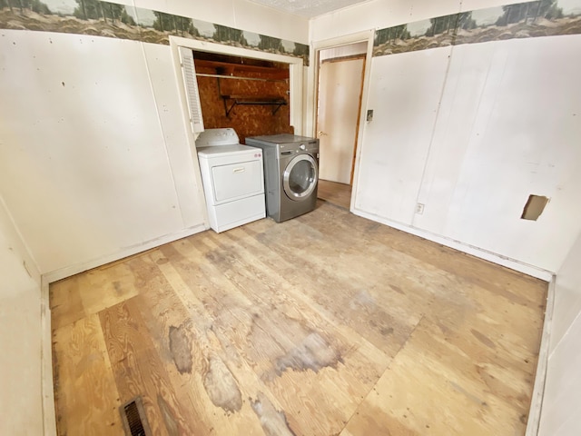 washroom featuring separate washer and dryer