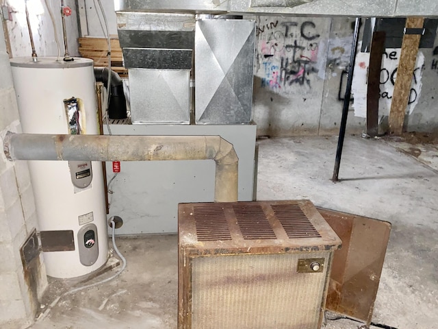 utility room featuring water heater