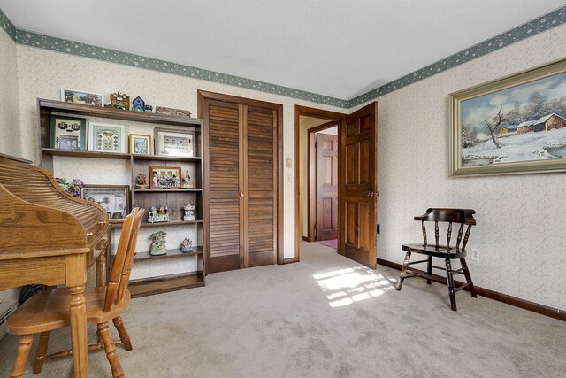 sitting room featuring light carpet