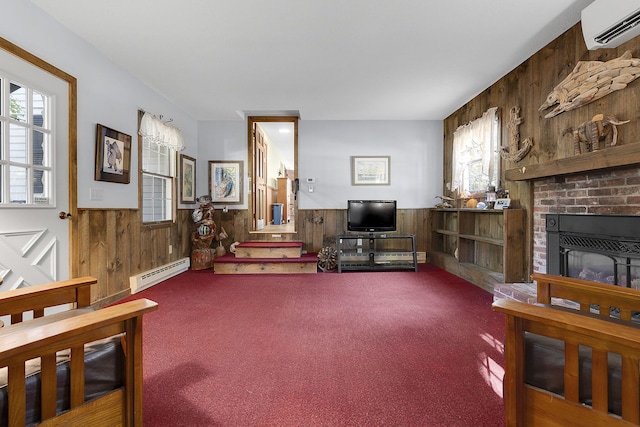 carpeted living room with a healthy amount of sunlight, baseboard heating, wood walls, and a wall unit AC