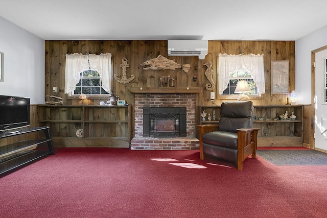 living room with plenty of natural light, carpet, wood walls, and a wall mounted AC