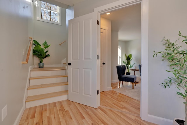 stairway featuring hardwood / wood-style flooring