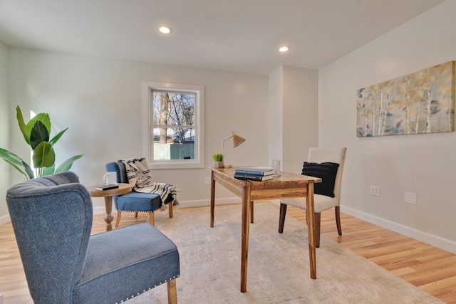 office space with wood-type flooring