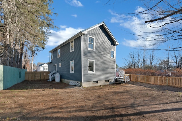 back of property featuring a lawn