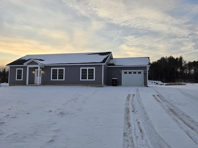 ranch-style home featuring a garage