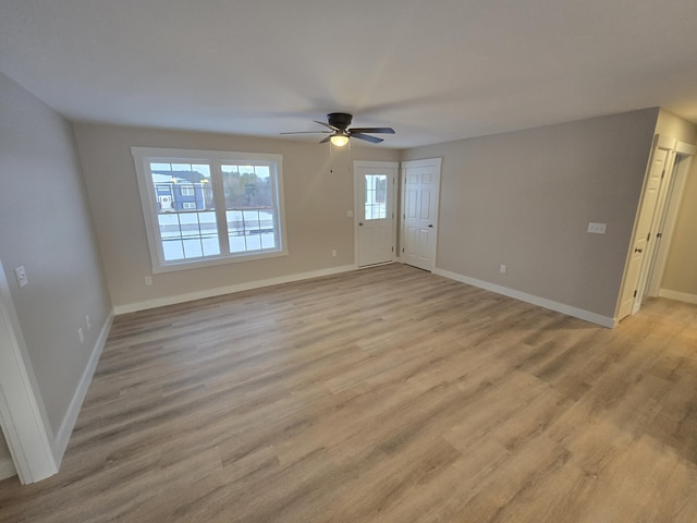 unfurnished room featuring ceiling fan and light hardwood / wood-style flooring