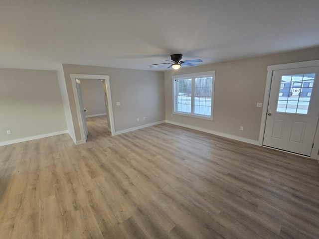 entryway with ceiling fan and light hardwood / wood-style flooring