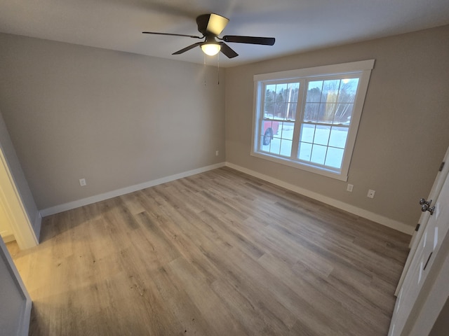 unfurnished room featuring ceiling fan and light hardwood / wood-style floors