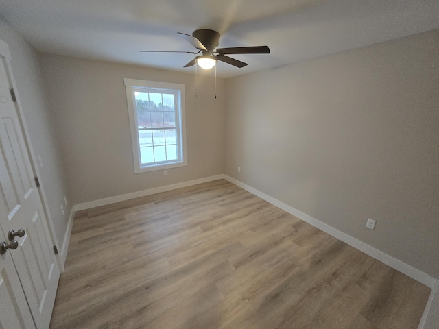 unfurnished room featuring ceiling fan and light hardwood / wood-style flooring