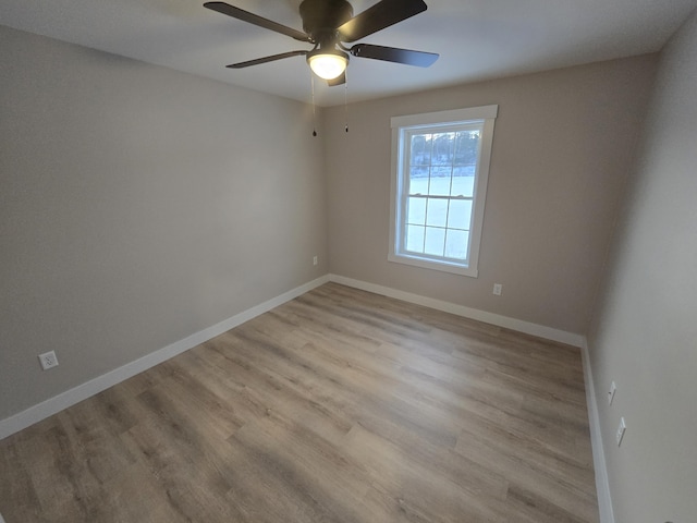 spare room with ceiling fan and light hardwood / wood-style flooring