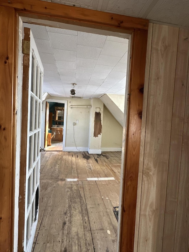 additional living space featuring wood-type flooring