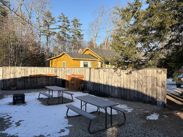 view of yard layered in snow