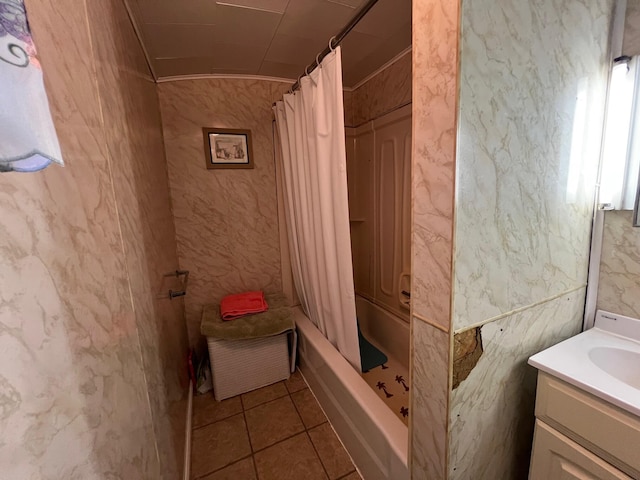 bathroom featuring tile patterned floors, walk in shower, and vanity