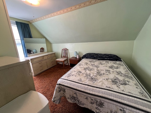 carpeted bedroom featuring lofted ceiling