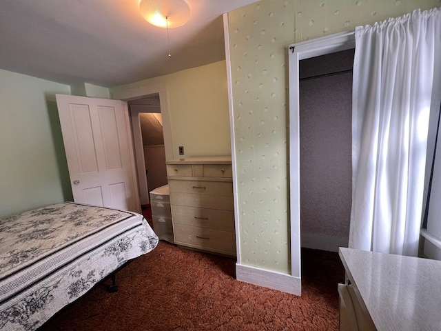 bedroom featuring dark colored carpet