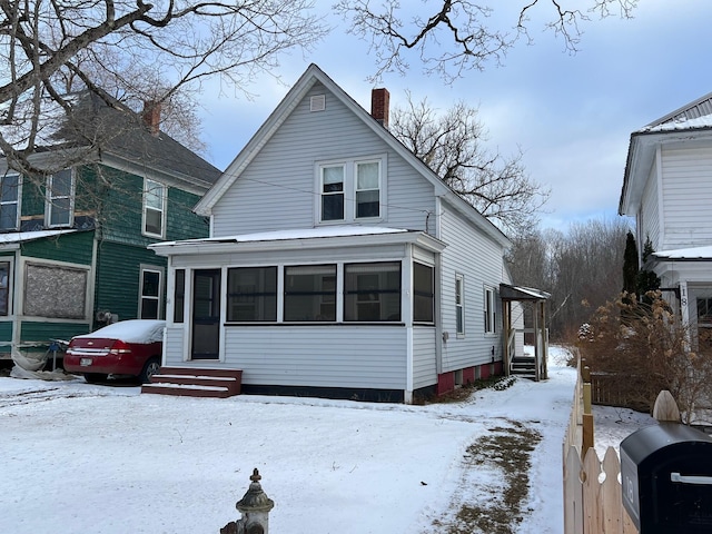 view of front of property with a sunroom