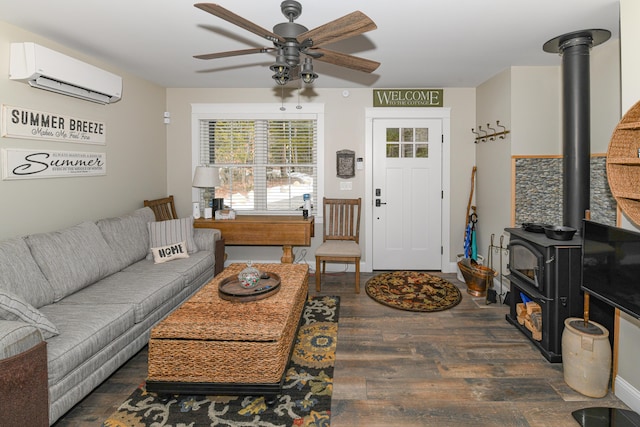 living room featuring ceiling fan, a wall mounted AC, dark hardwood / wood-style floors, and a wood stove