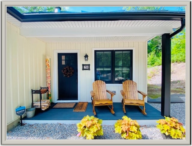 view of exterior entry featuring a porch