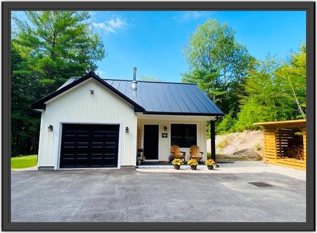 modern farmhouse style home with a porch and a garage