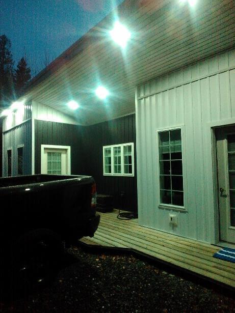 view of side of home with a hot tub