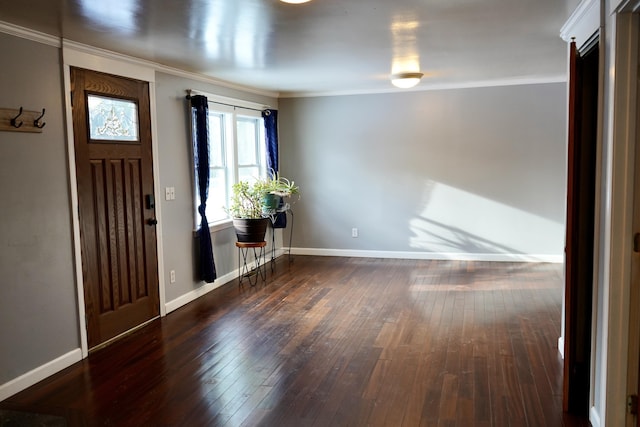 foyer featuring dark wood-type flooring and crown molding