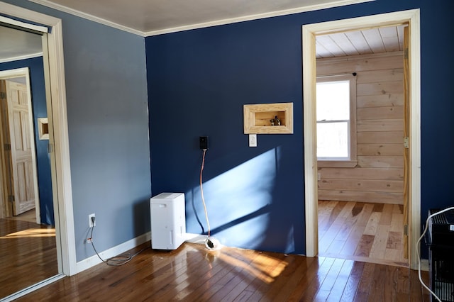 bedroom with wood-type flooring and ornamental molding