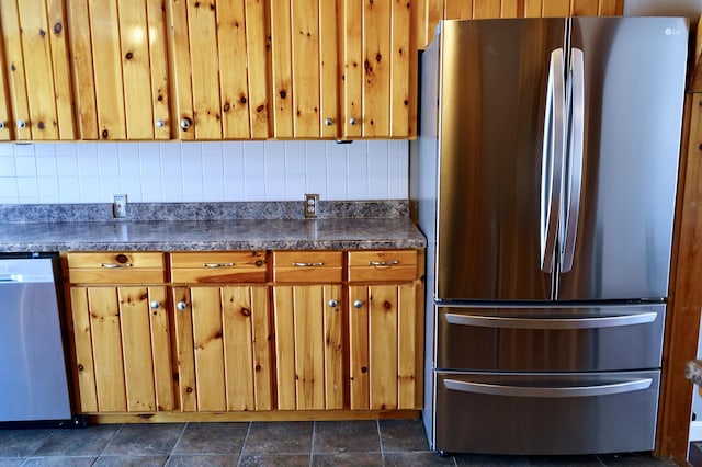 kitchen featuring backsplash and stainless steel appliances