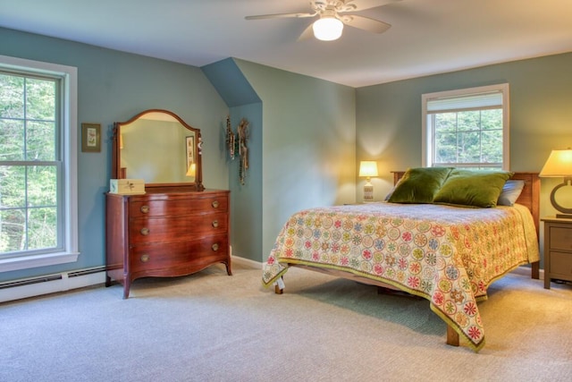 bedroom with ceiling fan, multiple windows, and light carpet