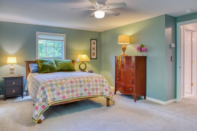 bedroom featuring ceiling fan and light carpet