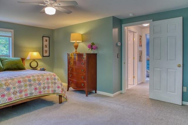 bedroom featuring light carpet and ceiling fan