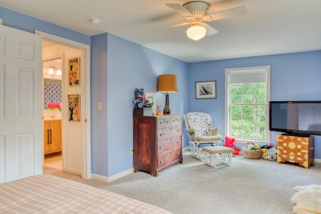 carpeted bedroom with ceiling fan and connected bathroom