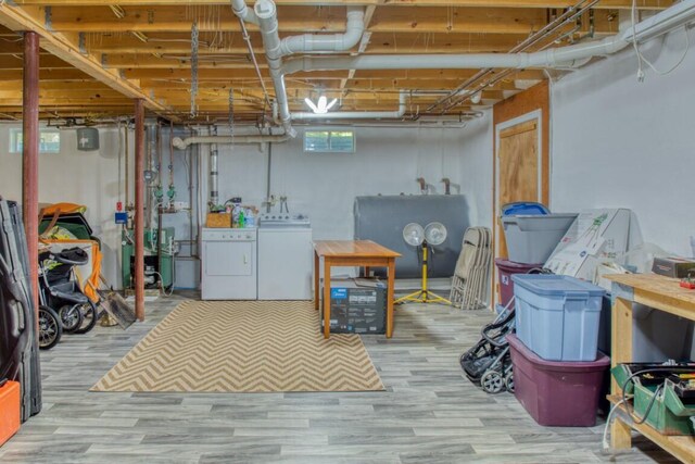 basement with separate washer and dryer and hardwood / wood-style floors