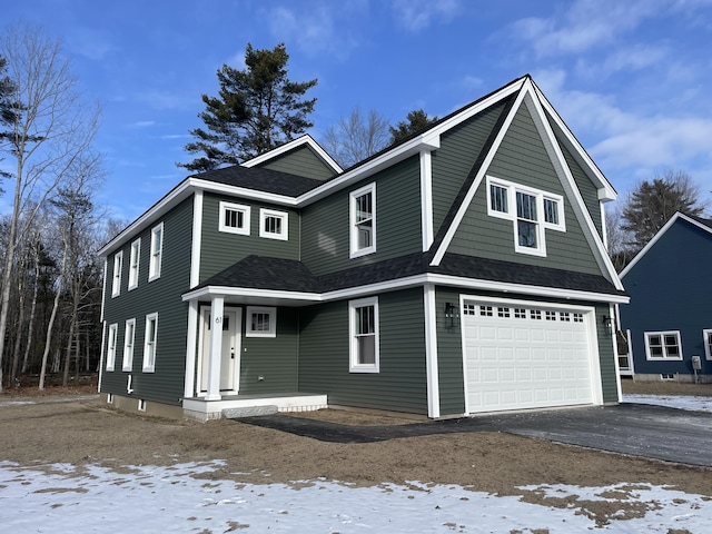 view of front of property with a garage