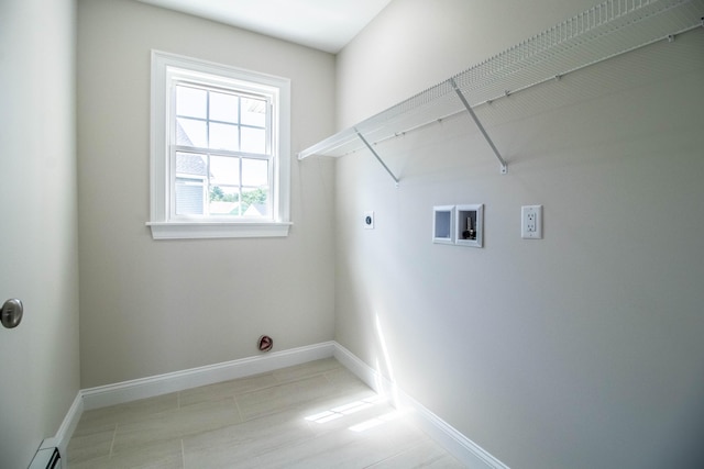 clothes washing area with a baseboard radiator, hookup for a washing machine, and hookup for an electric dryer