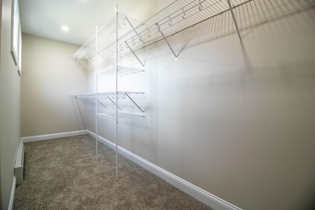 spacious closet with a baseboard radiator