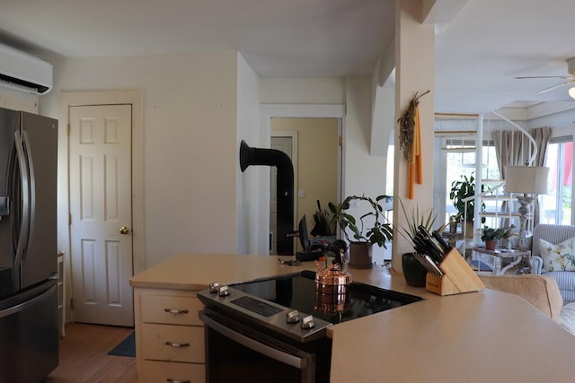 kitchen with an AC wall unit, stainless steel electric range, light wood-type flooring, ceiling fan, and black fridge with ice dispenser