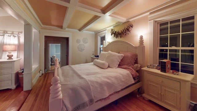 bedroom featuring light hardwood / wood-style floors, beamed ceiling, and coffered ceiling